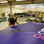 Preparing Giant Banner for European Cycling Championships
