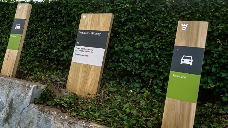Oak Monolith Parking Signs with Routered Logos and Aluminium Panels