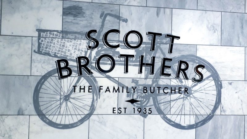 Scott Brothers Sign Writing on Marble Wall