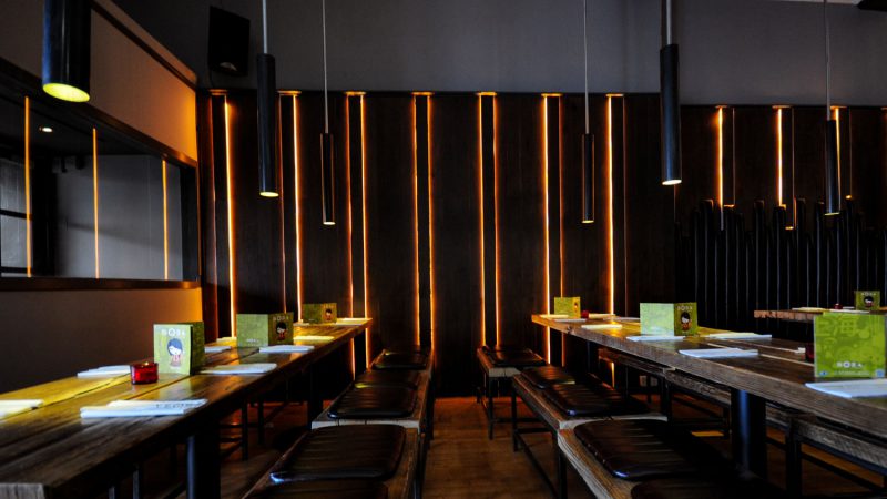 Illuminated walls and bespoke joinery in restaurant