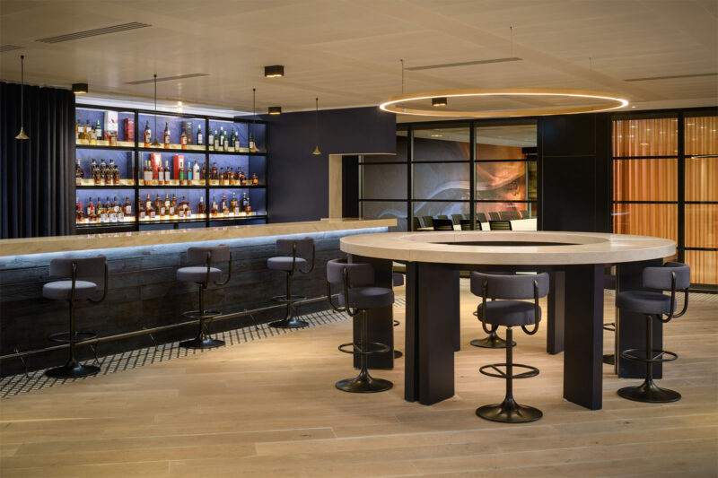 Luxurious bar fitout incorporating bespoke digital wallpapers, stylish lighting features and high-quality joinery componentry