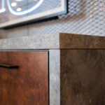 Furniture componentry with industrial metallic finishes